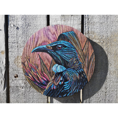 Tui in flax upon timber reworked outdoor art